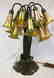 PATINATED BRONZE AND GLASS EIGHTEEN-LIGHT LILY LAMP