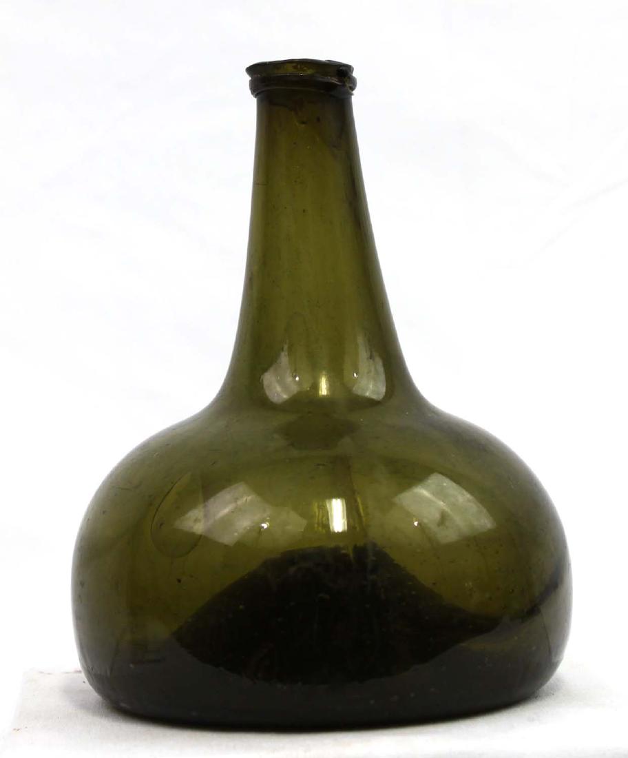 18 Century green glass Wine bottle: 18 Century green glass Wine bottle Size: Height 7 1/4 in. 5 1/4 in Base If you would like to receive more detailed photos, please let us know. We do not accept credit card charges of over $7,500, this