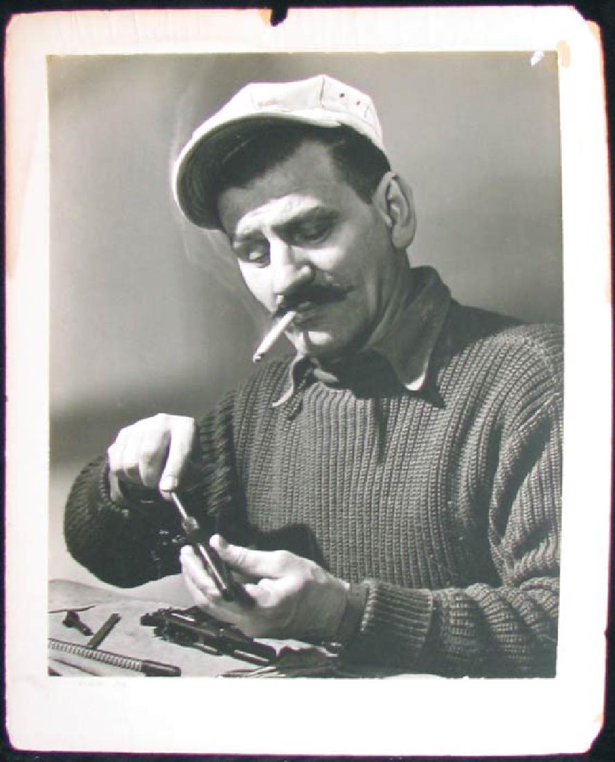 Old photograph of Repair Man: Old photograph of Repair Man Title: “REPAIR JOB ” Back stamped “ARTHUR J. CASSIDY 105 HOLLAND AVE. NEW MILFORD, N. J. and sticker is pasted on the back from Exhibition at Ridgewood Camera Club H