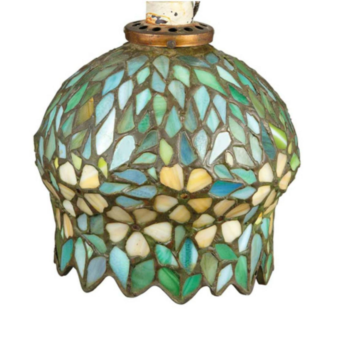 American Leaded Glass Shade: American Leaded Glass Shade Attributed to Apollo Studios, New York, first quarter of the 20th century Of blossom form, in striated amber, green and blue, irregular rim. Height 7 1/8 inches. Bid to win