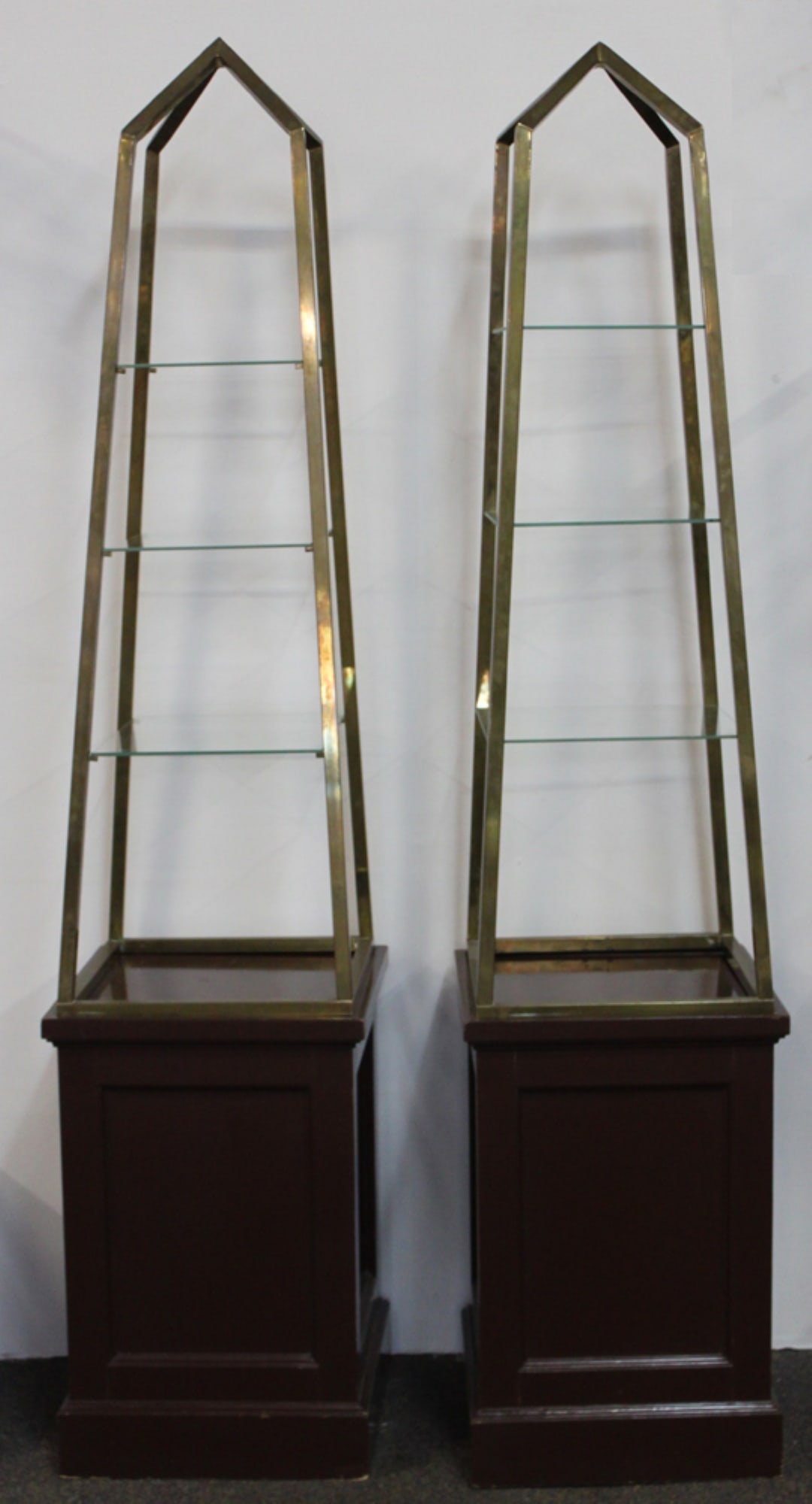 A Pair of Art Deco Brass Obelisk-Form Vitrine Stands, Attributed to Andre Arbus: A Pair of Art Deco Brass Obelisk-Form Vitrine Stands, Attributed to Andre Arbus Mid-20th century, attributed to renowned French designer Andre Arbus. Each vitrine is constructed in an elegant obelisk