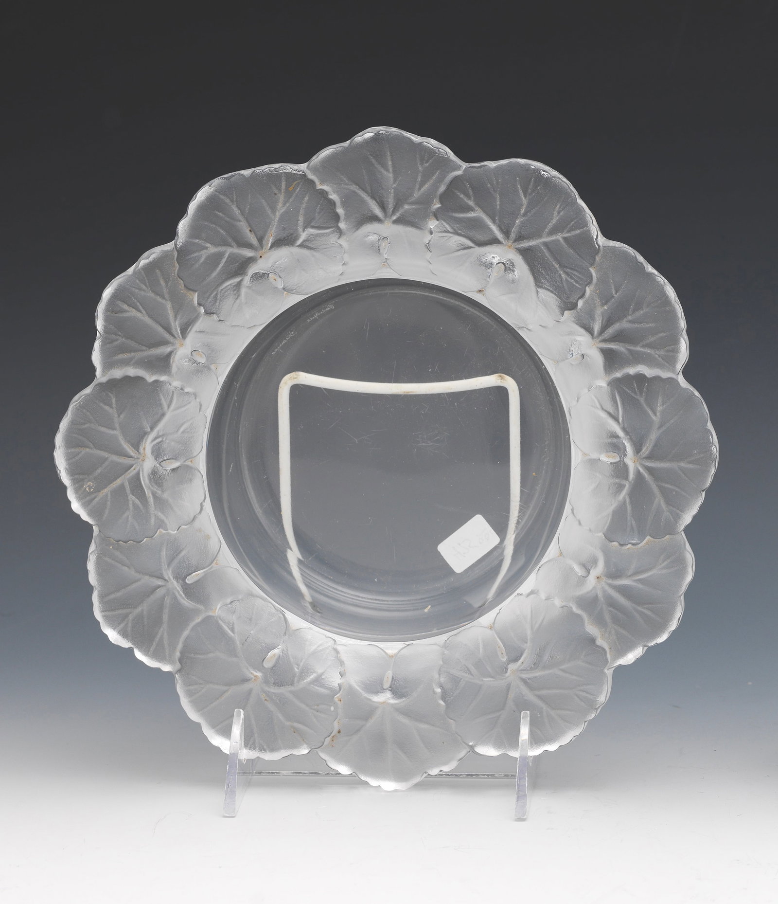 Beautiful frosted and clear crystal plate by Lalique, France: Beautiful frosted and clear crystal plate by Lalique, France, featuring a sculptural design of lotus leaves in relief around the border. The plate is etched "Lalique France" on the underside. Size: 8