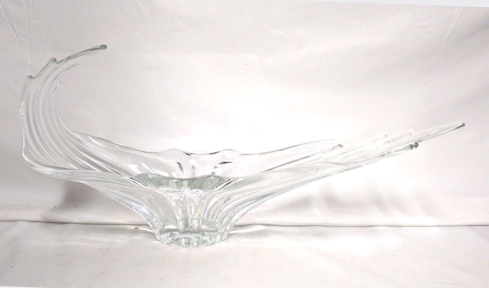 Italian Murano Art Glass Sculptural Centerpiece Bowl, Mid-20th Century: Italian Murano Art Glass Sculptural Centerpiece Bowl, Mid-20th Century Large free-form clear art-glass centerpiece bowl with dramatic winged form, heavy ribbed sides, and a gathered central foot, the