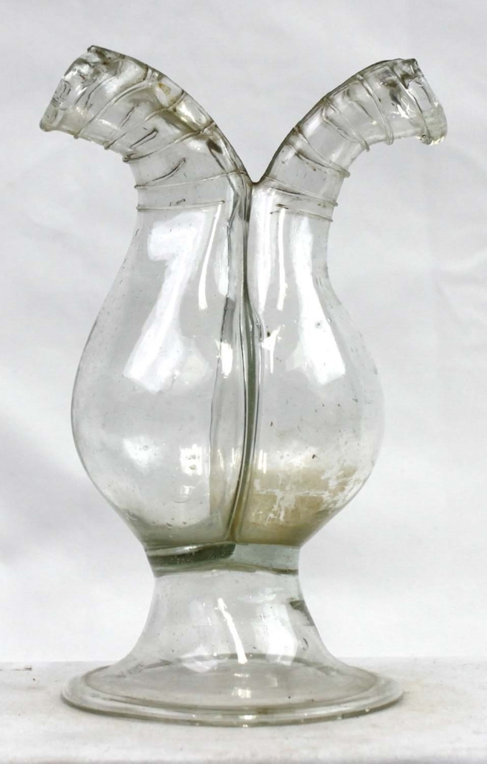Late 18th-Early 19th Century European Double-Spout Glass Cruet: Late 18th-Early 19th Century European Double-Spout Glass Cruet Free-blown clear glass cruet with a globular body and symmetrical twin pouring spouts, each applied and tooled with ring decoration. The