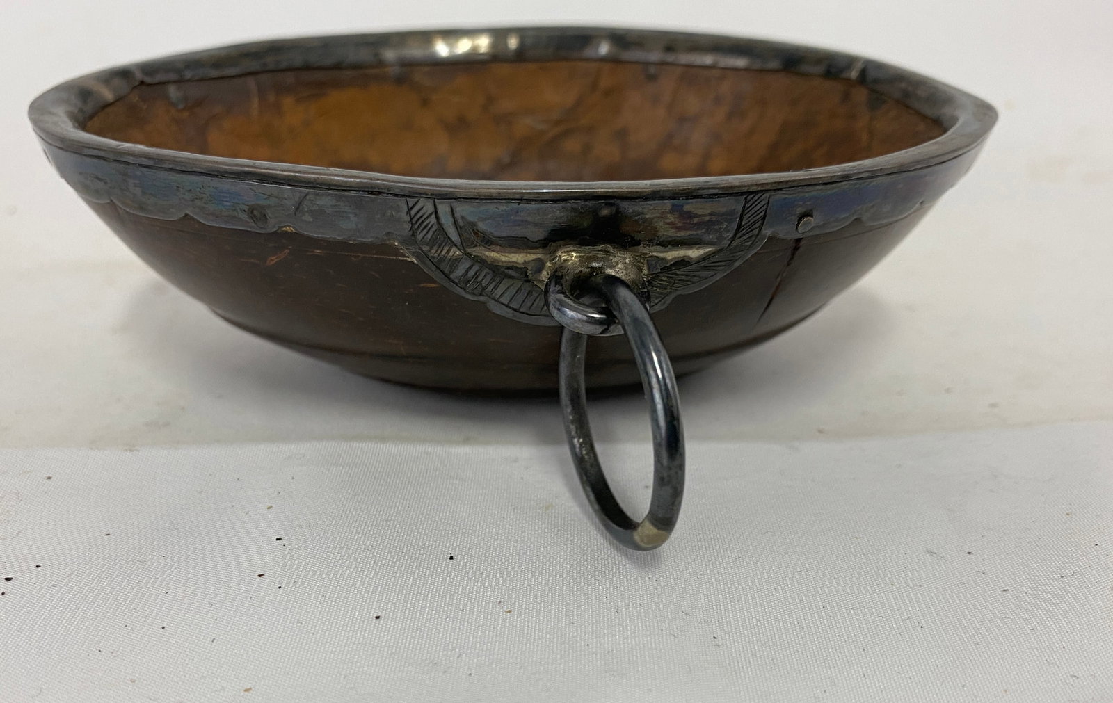 Coconut Shell Hanging Bowl with Iron Suspension Ring, 18th/19th C.: Coconut Shell Hanging Bowl with Iron Suspension Ring, 18th/19th C. Small portable bowl formed from a natural coconut shell, fitted with a hand-worked iron rim and an applied suspension lug with large