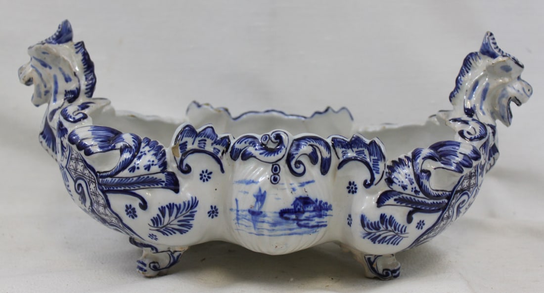 Delft Blue and White Faience Centerpiece Bowl with Seahorse Handles: Delft Blue and White Faience Centerpiece Bowl with Seahorse Handles An attractive Dutch Delft blue and white faience centerpiece bowl, likely 19th century, of elongated oval form raised on four scroll