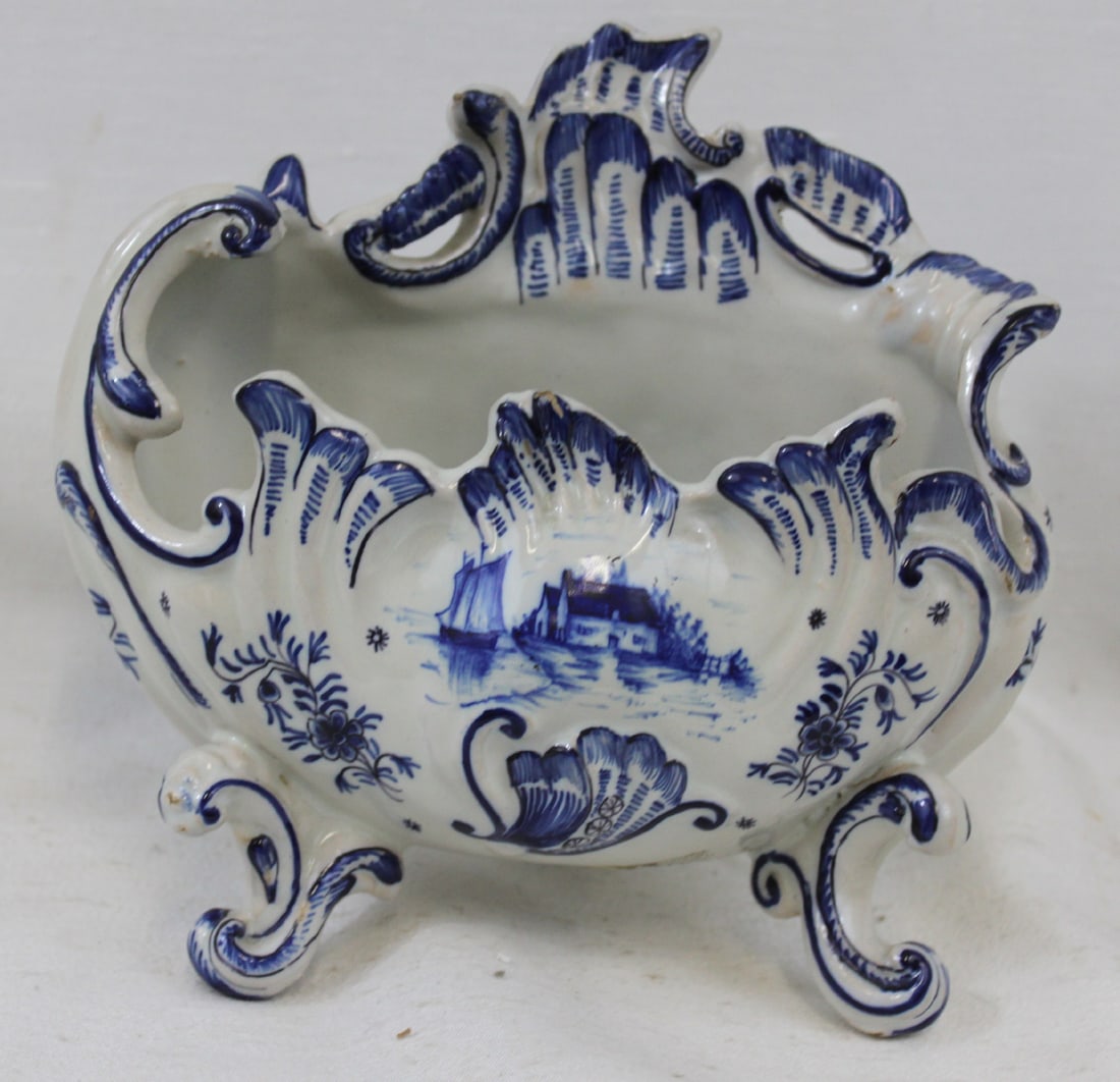 18th Century Dutch Delft Blue and White Rococo Footed Cachepot: 18th Century Dutch Delft Blue and White Rococo Footed Cachepot An exceptional Dutch Delft blue and white faience cachepot or jardiniere, of bold Rococo form, raised on four elaborately scrolled feet a
