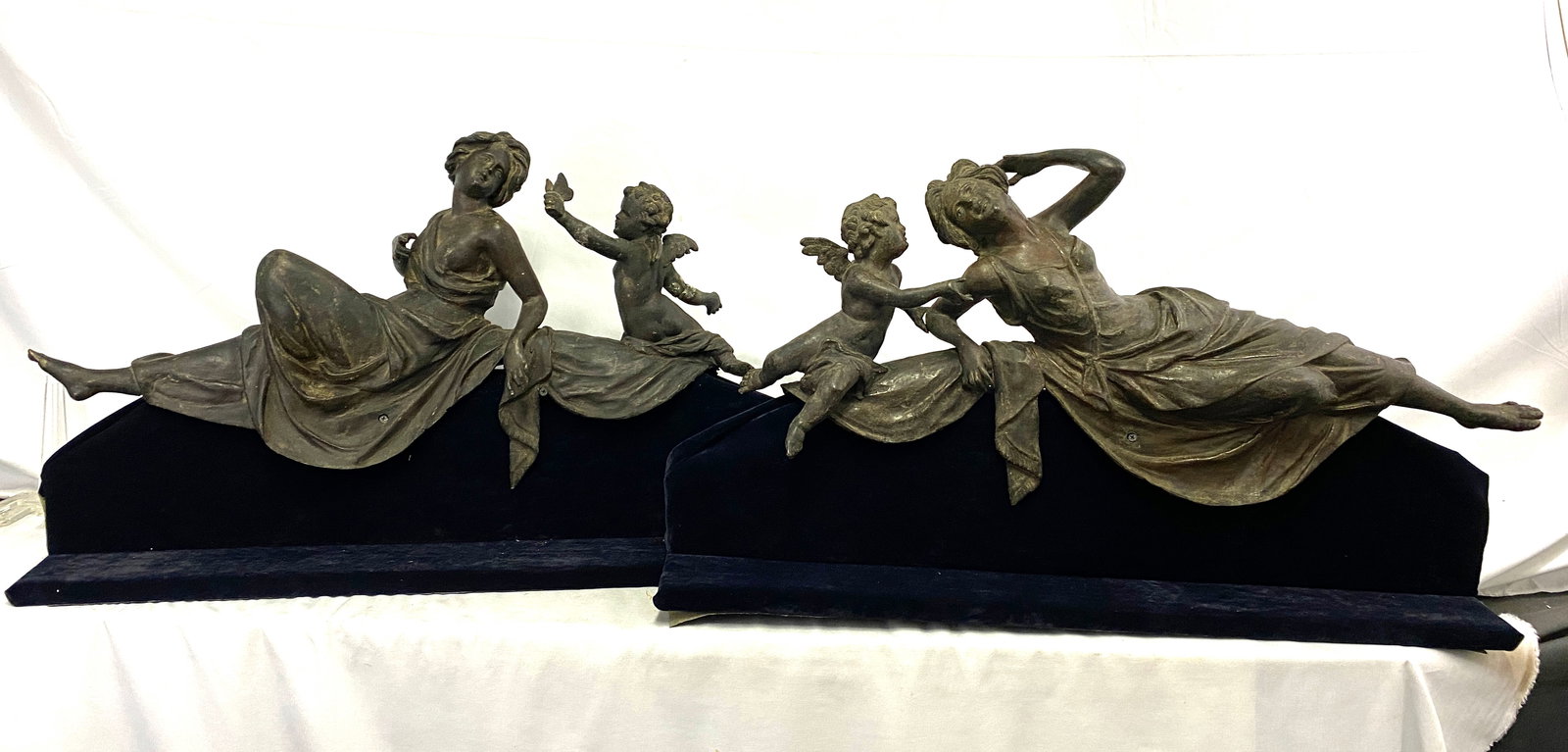 Pair of 19th-Century French Bronze Relief Sculptures with Nymphs and Putti: Pair of 19th-Century French Bronze Relief Sculptures with Nymphs and Putti A finely cast pair of large 19th-century French bronze sculptures in high relief, each depicting a reclining classical maiden