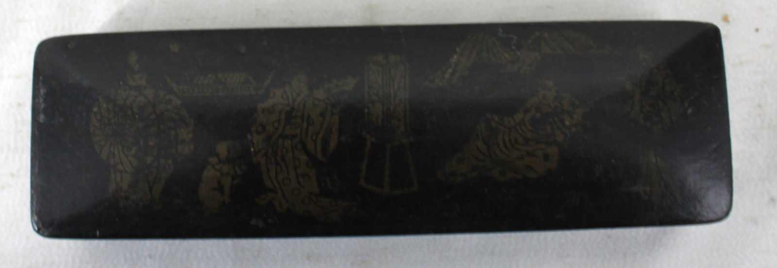 CHINESE BLACK LACQUER BOX WITH GILT FIGURAL DECORATION: CHINESE BLACK LACQUER BOX WITH GILT FIGURAL DECORATION Rectangular lacquered box decorated in gilt with a courtyard scene of figures, parasol and lantern, and pavilion architecture; interior fitted wi