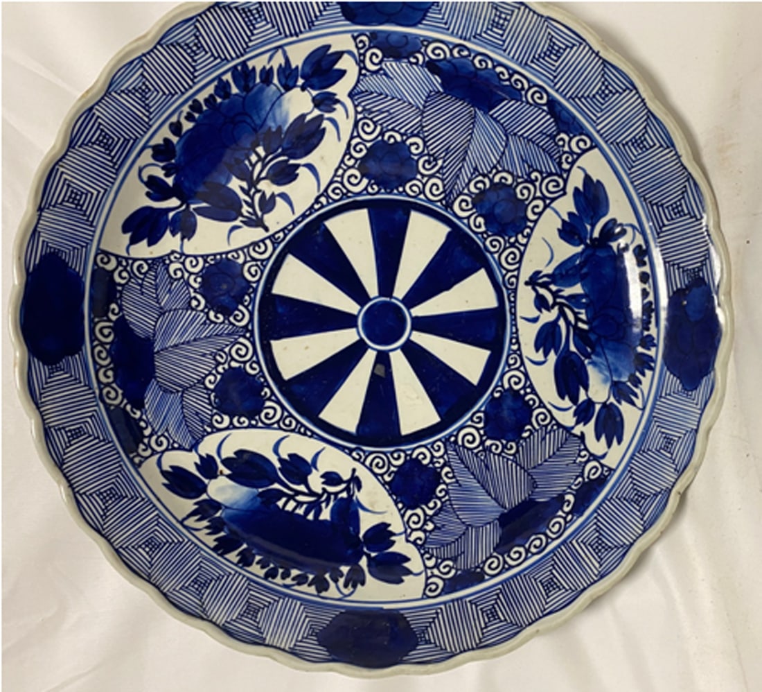 Large Japanese Arita Blue and White Charger: Large Japanese Arita Blue and White Charger Finely painted in deep cobalt blue with a central roundel of alternating radiating panels, the surrounding panels decorated with floral sprays and