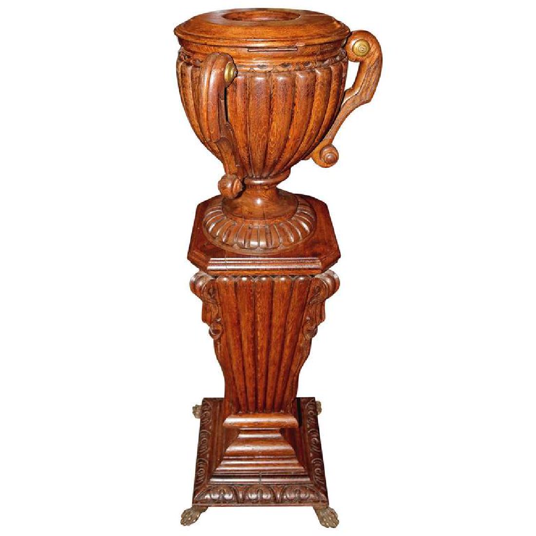 19th Century Wine Cellarette/Jardiniere on Matching: Beautiful hand-carved wine cellarette / jardinie`re with matching carved pedestal with beautiful bronze feet. This beautiful oak hand-carved shape of urn decorated with brass knobs. The cellarette ope