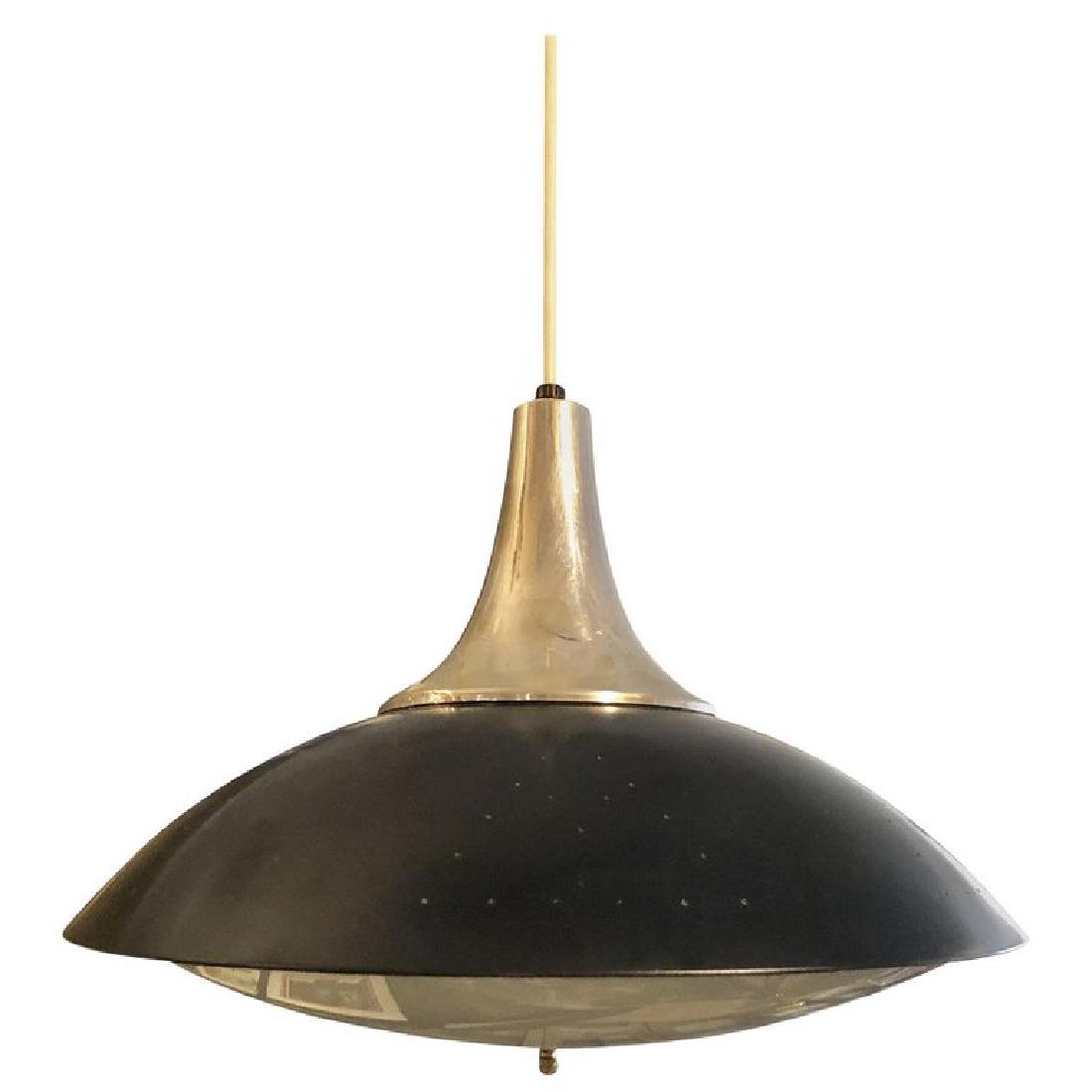 Mid-Century Modern Flying Saucer Pendant, 1950-1959: This flying saucer pendant is effortlessly chic and stylish. The pendant is made from black metal and features an aluminum cap with white rubber-covered wire and white rubber-covered cord. It can be h