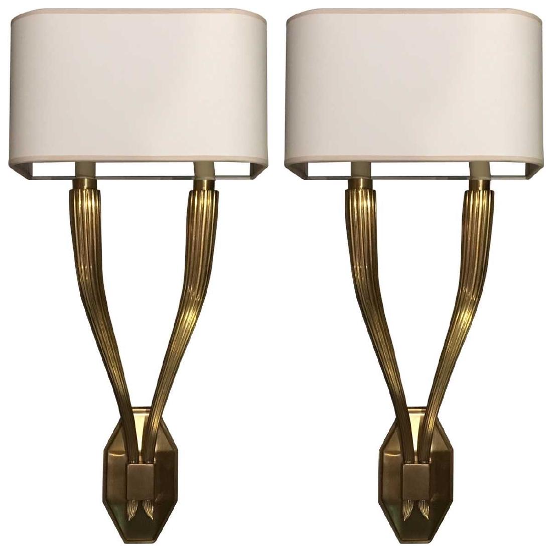 Contemporary Reeded Twin Sconces: Contemporary style encompasses a range of concepts developed in the latter half of the 20th century. Pieces feature soft, rounded lines as opposed to the stark edges seen in modern design. Brass, Pape