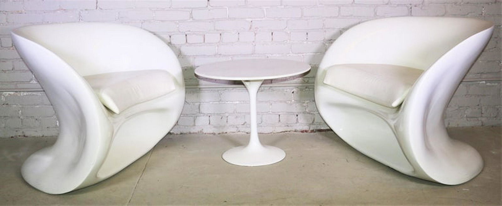 Curved Chairs And Side Table: Mid-Century Modern broadly describes designs from 1950s and 1960s post-war America. Influenced by Scandinavian minimalism, features organic, quirky geometric curvilinear shapes, sculptural lines, made