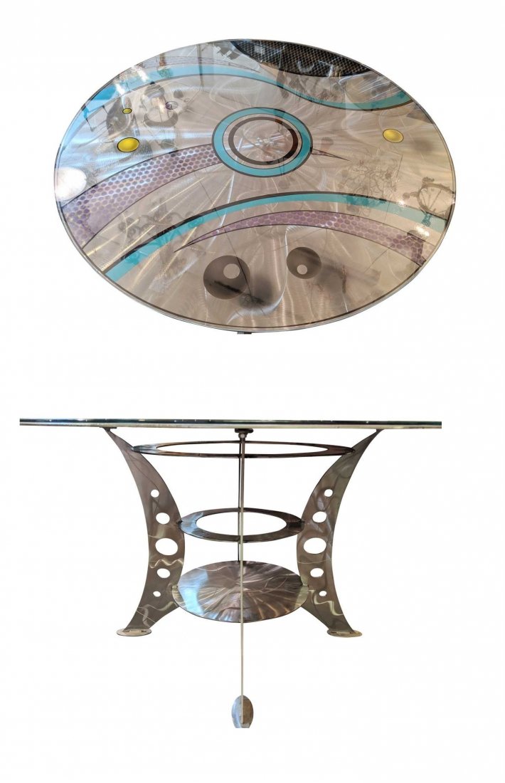 "Postmodern Round Dining Table": "Round dining table with four-legged pierced base with round double stretchers.Textured steel throughout with colorful abstract painting detailing to top.Protective glass cover for tabletop.Steel, Tem