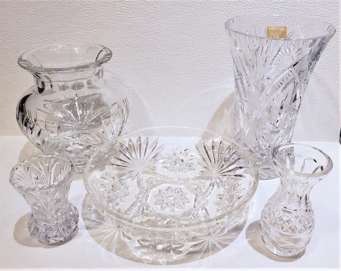 Set of Five Cut Crystal Vases And Center Piece: Cut crystal center piece with 4 vases to accentuate. The hand cut crystal is in pristine condition and has no chips or marks