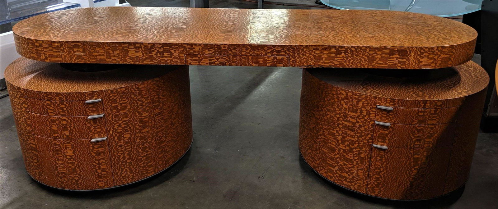 Chipped-Wood Executive Desk: Rounded executive desk with chipped-wood finish. Large rounded pedestals and drawers on each pedestal. 90 x 31 x 38 in