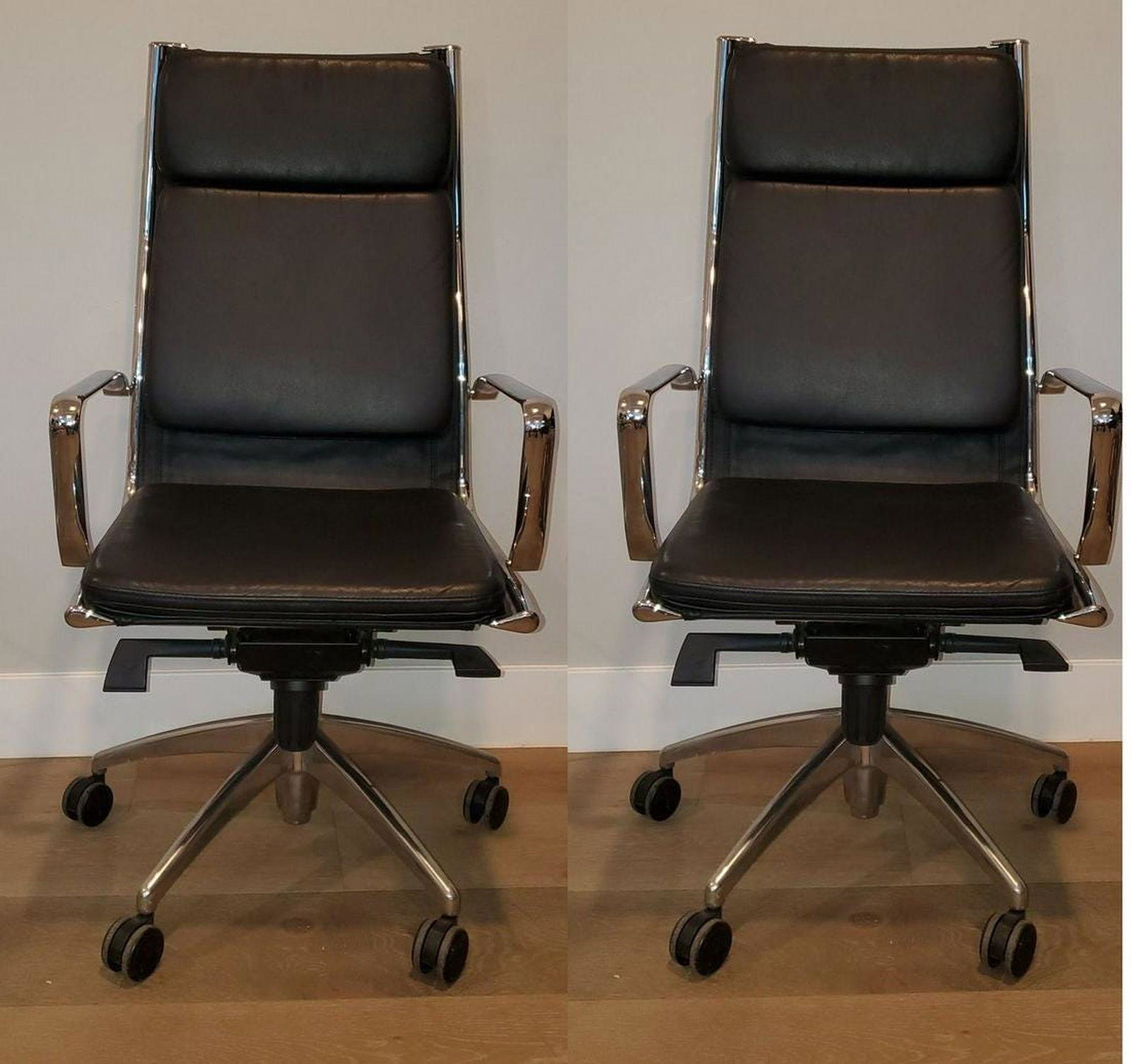 Manner of Charles and Ray Aims Soft pad ChairsManner of: 1980s modernistic rolling arm chars. fully functional. The leather has minor distress marks and the whole chair is in excellent condition