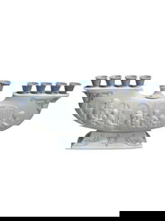 Menorah Lladro Candleholder: Celebrate the Festival of Lights with timeless elegance through this exquisite Lladró Menorah Candleholder, a masterful blend of spiritual tradition and fine porcelain artistry. Crafted in Spain by
