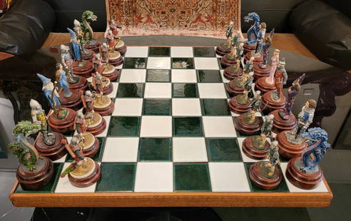 Tiled Mid Century and Wood Chess Board With Chess Figurines: Tiled Mid Century and Wood Chess Board with Chess Figurines. Green and White tiles throughout. Each chess piece is placed above a wooden stand. Each piece is hand painted. There are 2 missing arrows t