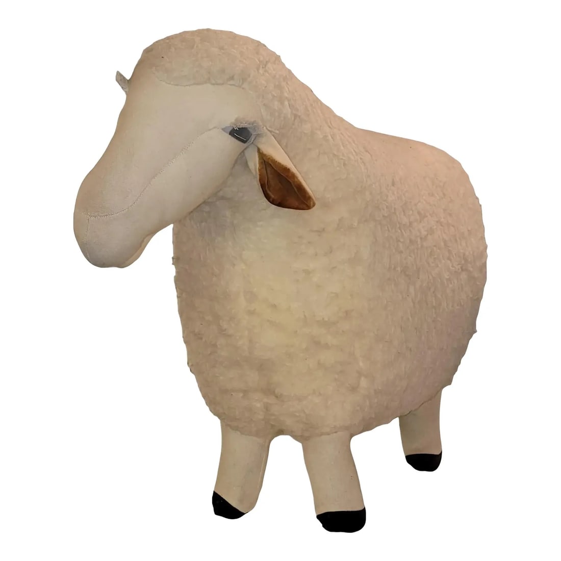 1980s Decorative Lamb Stool in Wool: 80s Decorative Standing Stool Sheep in wool With Fabric Legs. The wool goes all the way through the body to the bottom o the sheep in which the legs are sewn onto the wool. W33 x D13 x H24