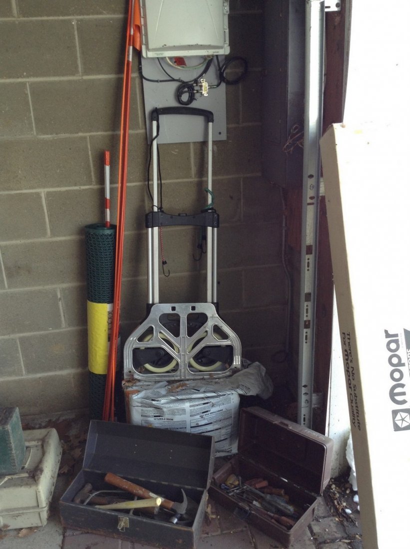 Toolboxes loaded with tools; peatmoss plastic fencing, (1 of 2)