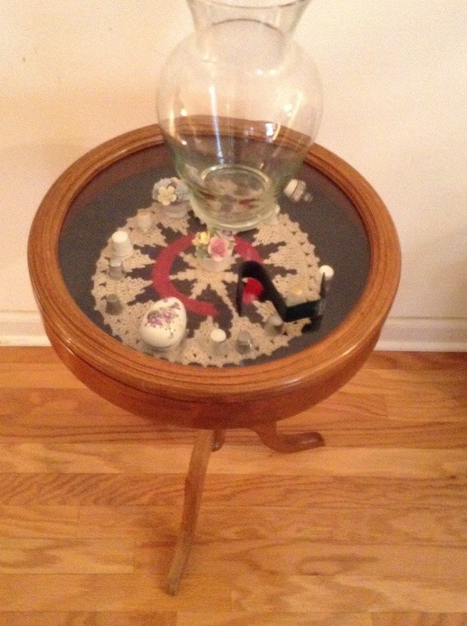 Small glass top table with contents: Small glass top table with contents: included thImbles hand painted items and more