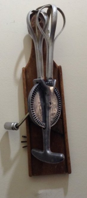 Vintage Kitchen ware hanging in stairwell (1 of 6)