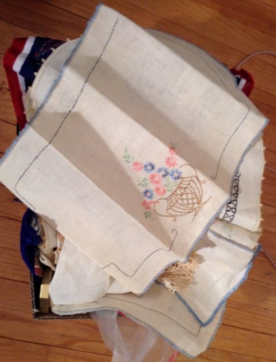Box full of vintage Hand embroidered linens place mats: Box full of vintage Hand embroidered linens place mats and more