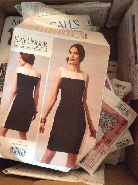 Box full of various sized    sewing patterns (1 of 2)