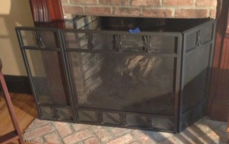 Steel and cast iron steel fireplace cover: 53 inches wide by 30 inches tall