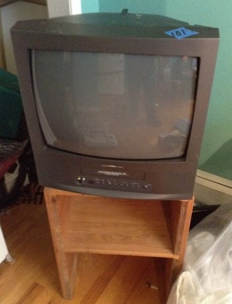 Wooden TV Stand and TV: Wooden TV stand (24 inches tall x 12 inches deep and 18 inches wide) and Curtis Mathis TV with built in VHS player