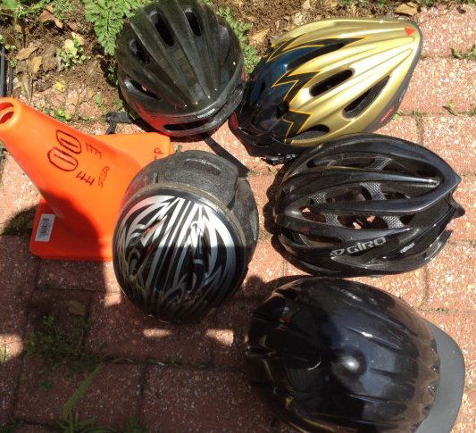 Lot of bike helmets: Various bike helmets and cones