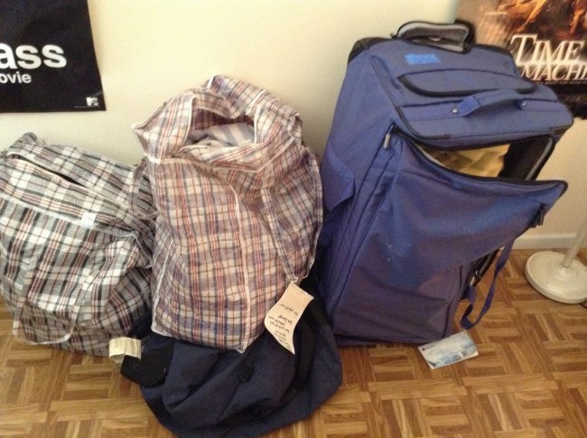 Luggage and bags of clothing: Luggage and bags of clothing - includes egg crate mattress