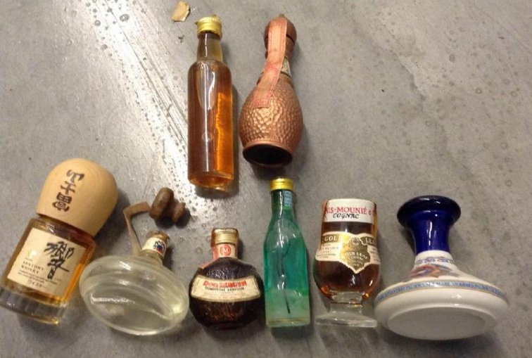 Lot of 7 miniture liquor Bottles: Any contents in bottle is Free; You are bidding on the bottle