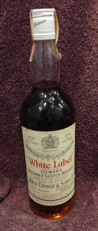 White Label Dewar's Blended Scoth Whiskey: Any contents in bottle is Free; You are bidding on the bottle