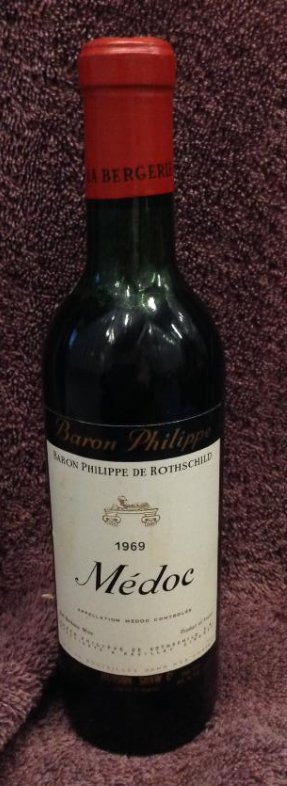 1969 Baron Philippe Me' doc 12 fl oz.: Any contents in bottle is Free; You are bidding on the bottle