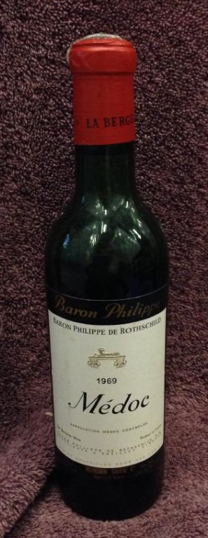 1969 Baron Philippe Me' doc 12 fl oz.: Any contents in bottle is Free; You are bidding on the bottle