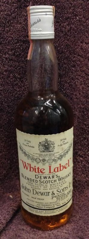 White Label Dewar's Blended Scotch Whisky 4/5 quart: Any contents in bottle is Free; You are bidding on the bottle