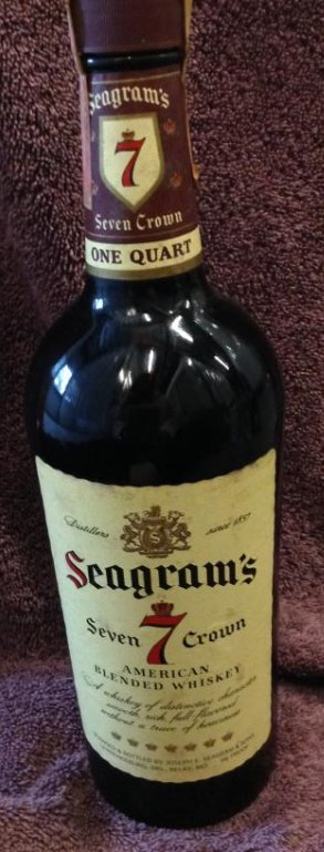 Seagram's Seven Crown American Whiskey one quart: Any contents in bottle is Free; You are bidding on the bottle