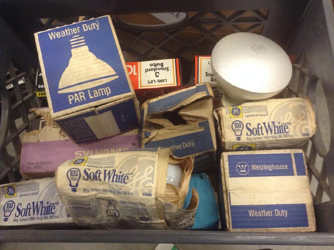 Milk crate full of light bulbs: Milk crate full of light bulbs