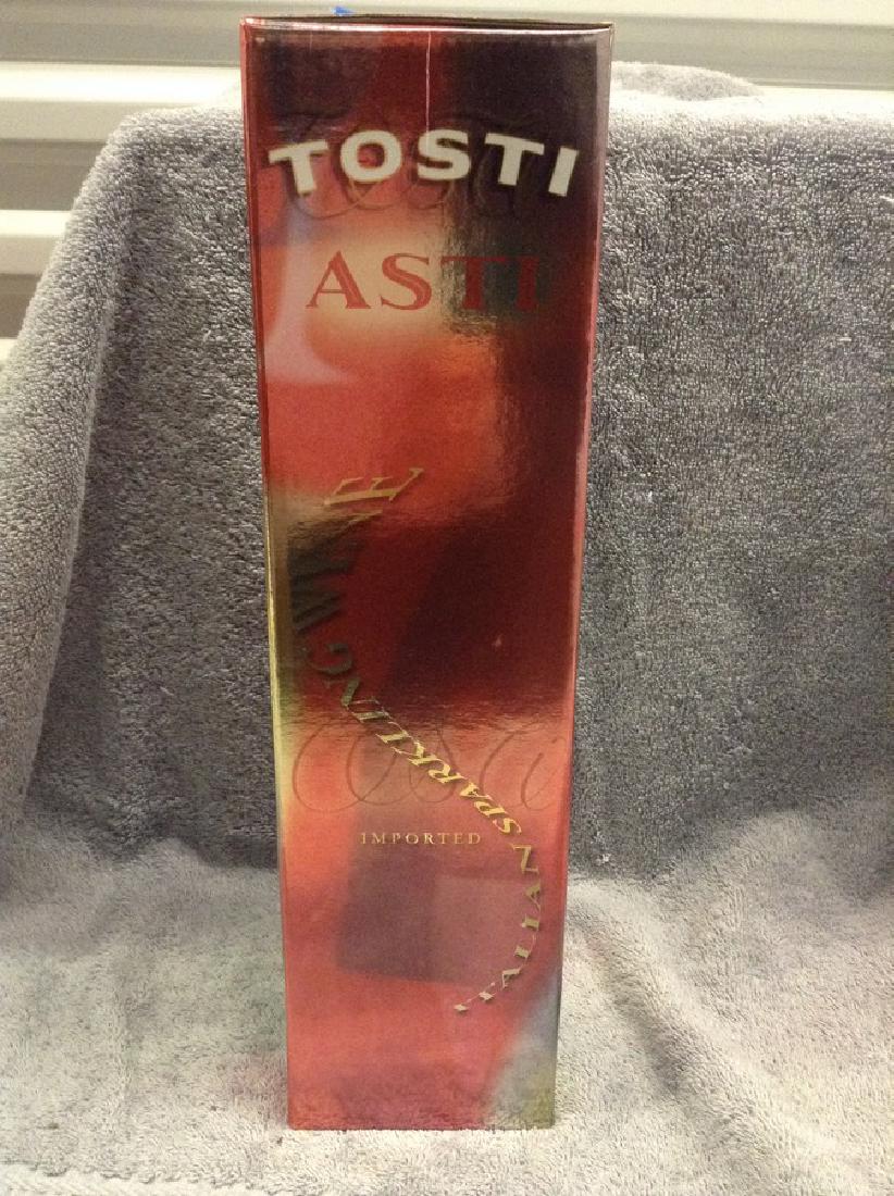 Tosti Asti - 750ml in box: Any contents in bottle is Free; You are bidding on the bottle & unbroken tax stamp
