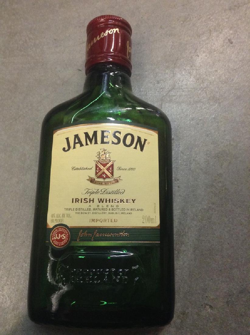Jameson Irish Whiskey 200ml: Any contents in bottle is Free; You are bidding on the bottle & unbroken tax stamp