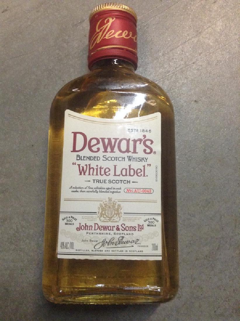 Dewar's Label Blend Scotch Whisky: Any contents in bottle is Free; You are bidding on the bottle & unbroken tax stamp