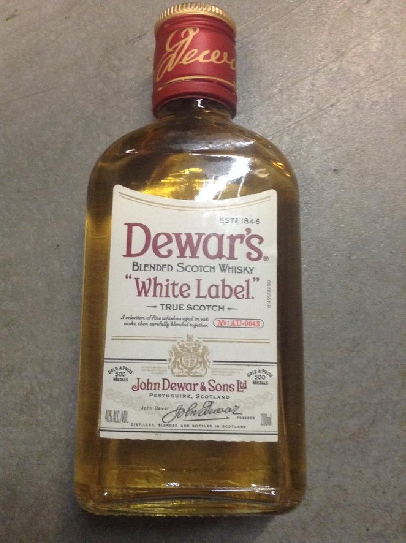 Dewar\'s Label Blend Scotch Whisky: Any contents in bottle is Free; You are bidding on the bottle & unbroken tax stamp