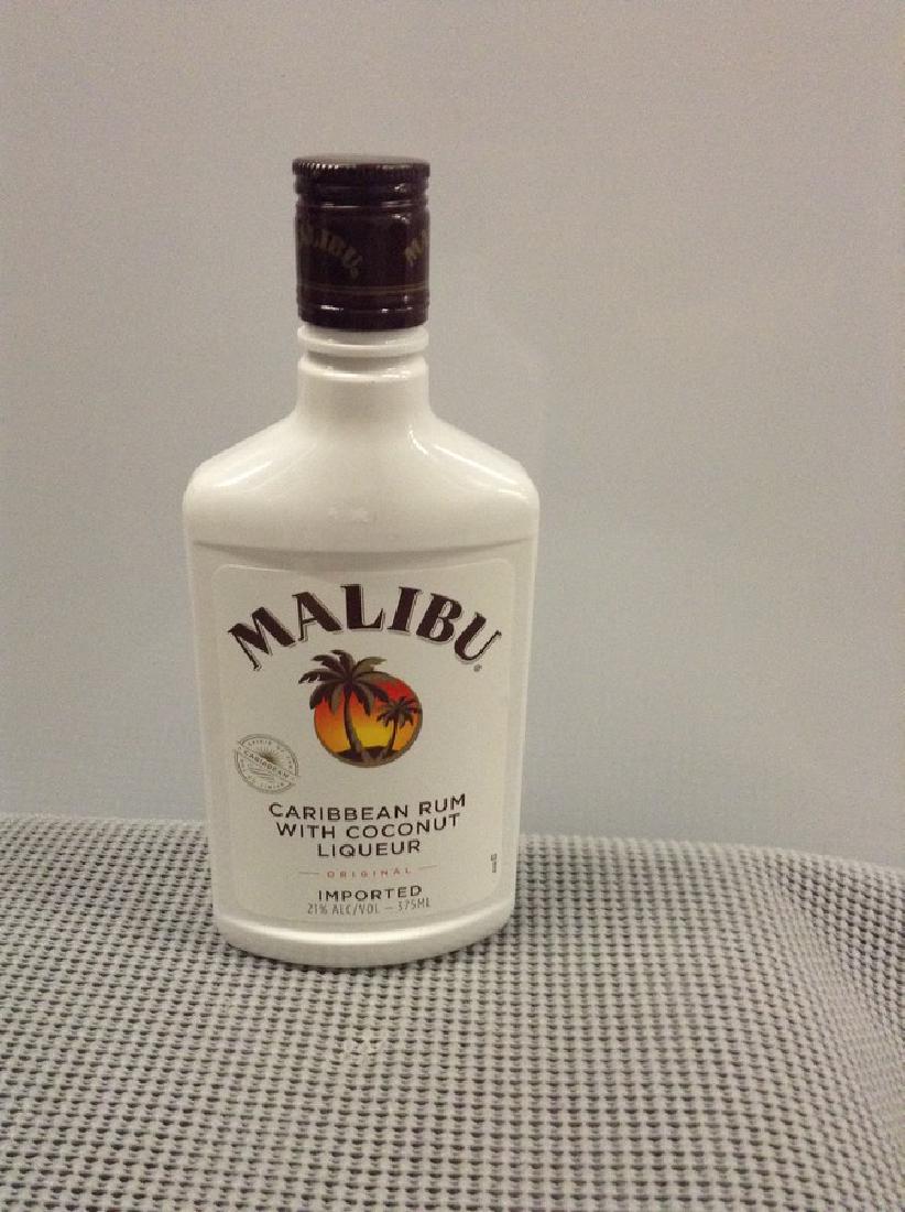 Malibu Coconut Rum: Any contents in bottle is Free; You are bidding on the bottle & unbroken tax stamp