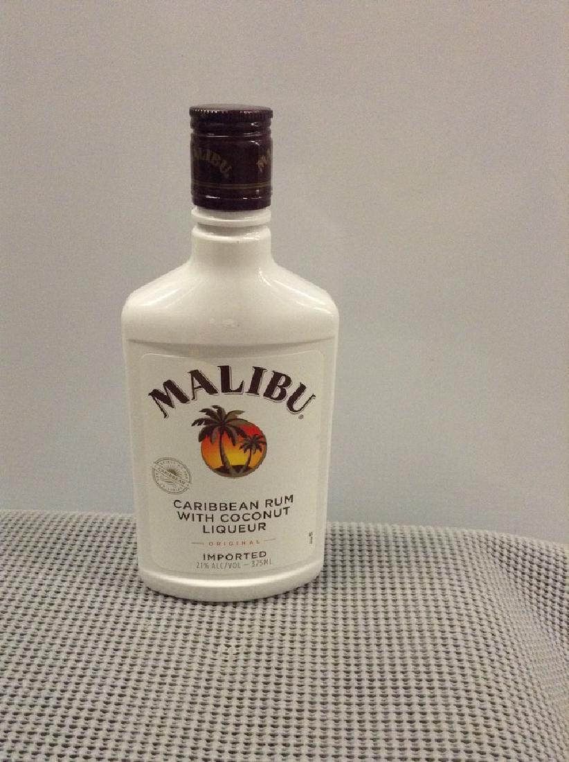 Malibu Coconut Rum: Any contents in bottle is Free; You are bidding on the bottle & unbroken tax stamp