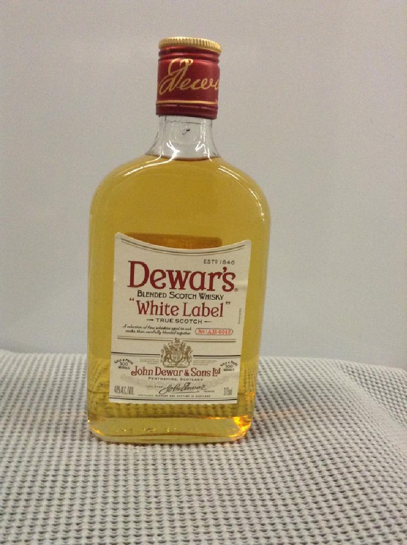 Dewar's White Label Scotch: Any contents in bottle is Free; You are bidding on the bottle & unbroken tax stamp