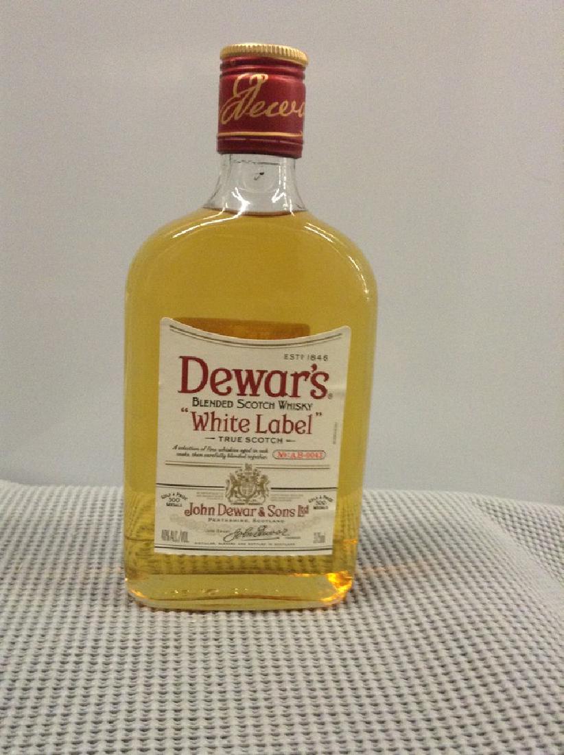 Dewar's White Label Scotch: Any contents in bottle is Free; You are bidding on the bottle & unbroken tax stamp