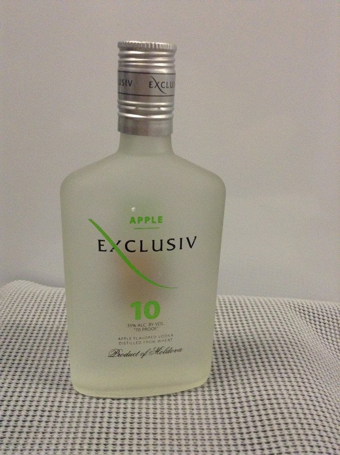 Exclusiv Apple Vodka # 10 375 ML: Any contents in bottle is Free; You are bidding on the bottle & unbroken tax stamp